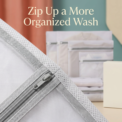Close-up of a gray zipper and white mesh seam on the laundry wash bag.